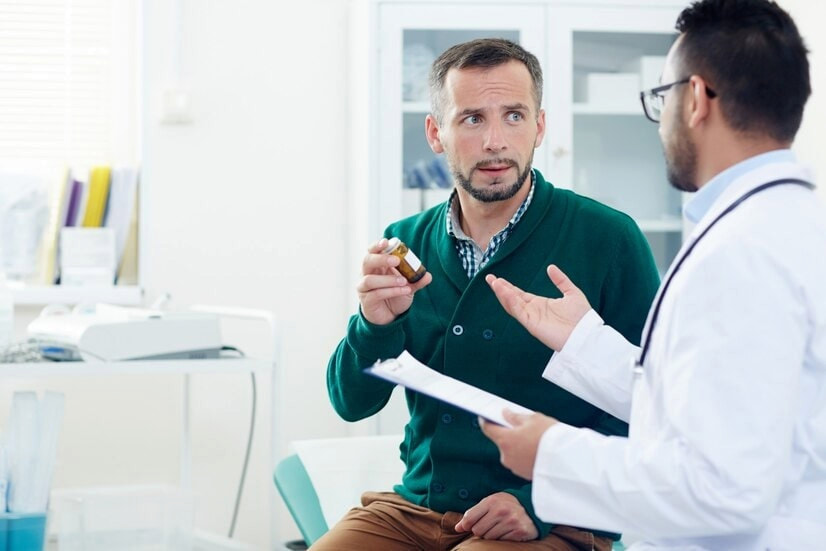 man-consulting-with-a-healthcare-professional-about-pelvic-pain-and-intimacy-concerns-essential-mens-clinic